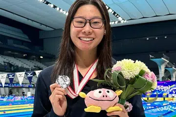 LAYAK BERSAING: Letitia Sim mencatat rekod kebangsaan dan merangkul perak dalam acara 100 meter melayakkan diri untuk bersaing di Sukan Olimpik.