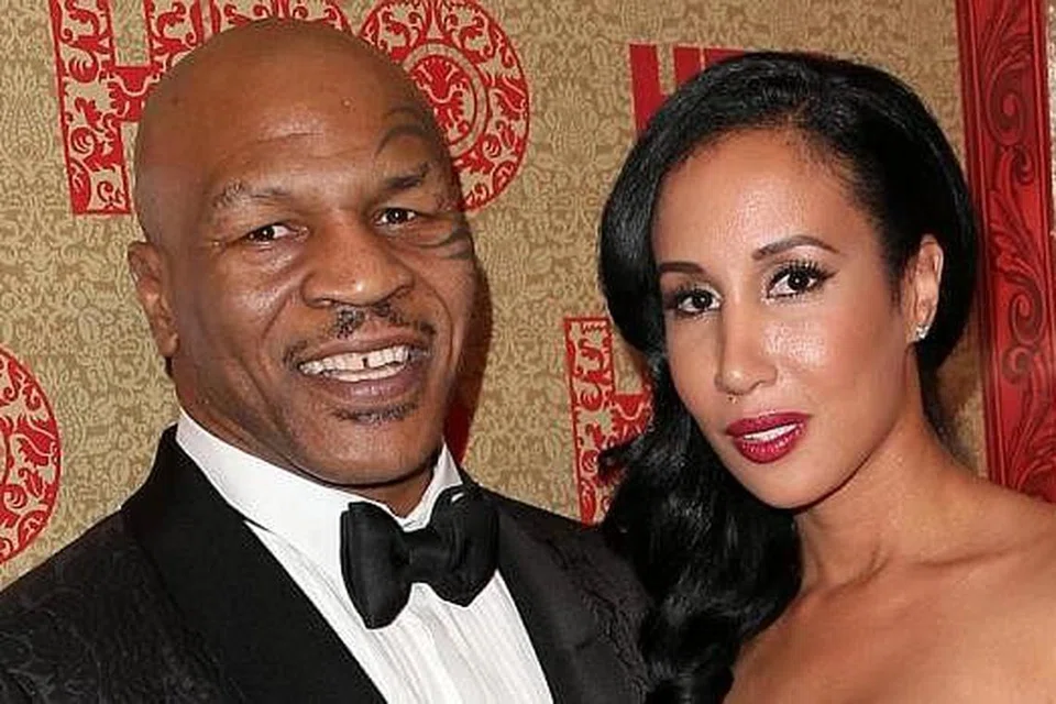 BAKAL BUAT FILEM?: Mike Tyson dan isterinya Lakiha Spicer dikatakan sedang menghasilkan projek filem rencana mengenai dirinya. - Foto AFP
