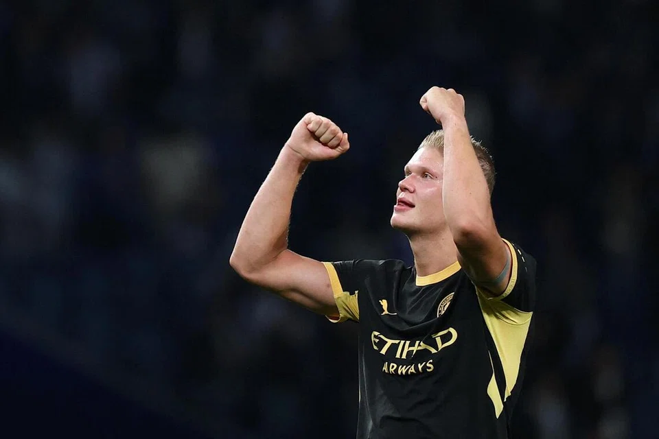 Penyerang Manchester City, Erling Haaland, meraikan kemenangan pasukannya ke atas Porto, selepas aksi Liga Juara-Juara di Stadium do Dragao, Porto, Portugal, pada 8 September.