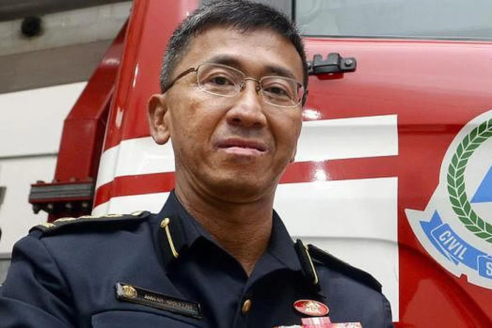 DEDIKASI DIIKTIRAF: Pengarah Jabatan Operasi SCDF, Kolonel Anwar Abdullah (gambar), dinaikkan pangkat menjadi Penolong Pesuruhjaya sementara Komander Divisyen Pertahanan Awam Kedua, Leftenan Kolonel (LTC) Kadir Maideen Mohamed, dinaikkan pangkat menjadi Kolonel. - Foto-foto TAUFIK A. KADER