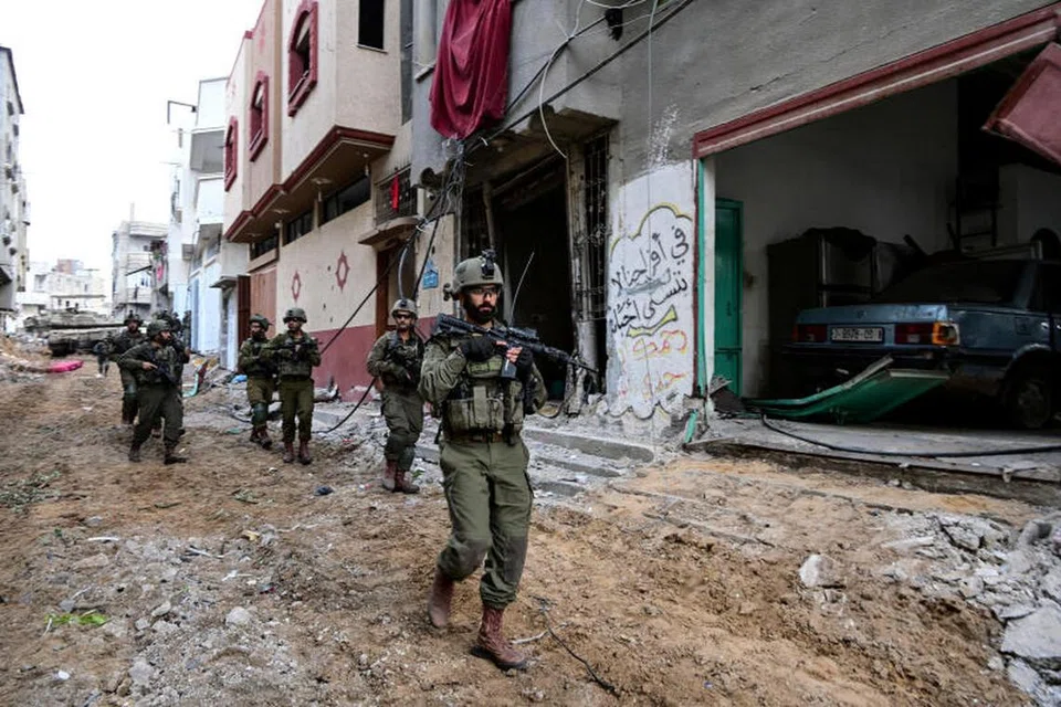 PERANG BERTERUSAN: Askar Israel telah memasuki daerah Shajaiya di Bandar Gaza di tengah-tengah pertempuran yang masih berlarutan. 