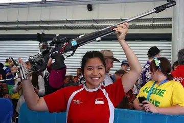 SRIKANDI NEGARA: Penembak muda Singapura, Martina Veloso, meraikan emas keduanya di Sukan Komanwel ini semalam. - Foto AFP
