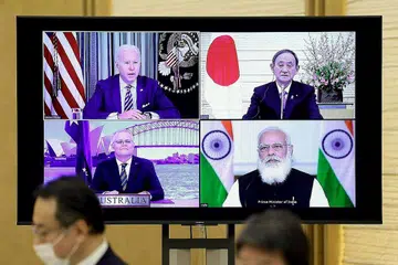 PERTEMUAN PERTAMA: (Ikut putaran jam; dari kiri atas) Encik Biden, Encik Suga, Encik Modi dan Encik Morrison bertemu secara maya buat kali pertama di bawah naungan mesyuarat Quad. - Foto AFP