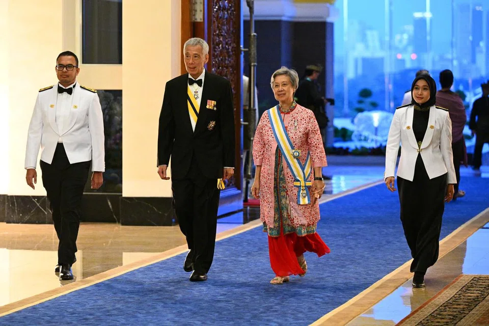 Menteri Kanan, Encik Lee Hsien Loong (dua dari kiri) dan isterinya, Cik Ho Ching (dua dari kanan), di Jamuan Diraja, di Istana Negara, Kuala Lumpur.