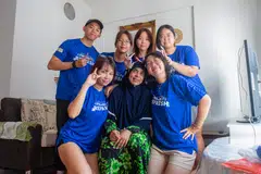 Dibelenggu kesunyian akibat tinggal sendiri di flatnya di Buangkok, Cik Zaitoon Nisa Hussain Khan (duduk, tengah), amat teruja apabila sukarelawan Majlis Pembangunan Masyarakat North East (NECDC) membersihkan rumahnya pada 6 April menjelang Hari Raya Aidilfitri.