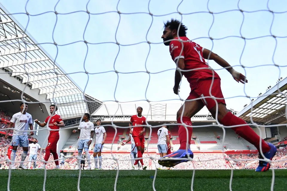 LIGA PERDANA ENGLAND: Penyerang Liverpool, Mohamed Salah, gembira selepas memasukkan gol ketiga pasukannya dalam perlawanan bola sepak bersama Aston Villa di Anfield pada 3 September.