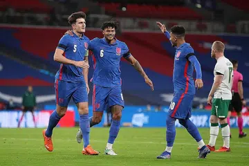 BANGKIT LEBIH BAIK: Harry Maguire (kiri) menyambut golnya bersama Tyrone Mings (tengah) dan Jadon Sancho (kanan) dalam kemenangan 3-0 England ke atas Ireland dalam perlawanan persahabatan di Stadium Wembley kelmarin. - Foto REUTERS