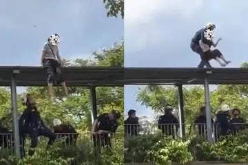 Polis dan SCDF menerima laporan seorang wanita sedang duduk di atas bumbung jejantas pada 2 April.