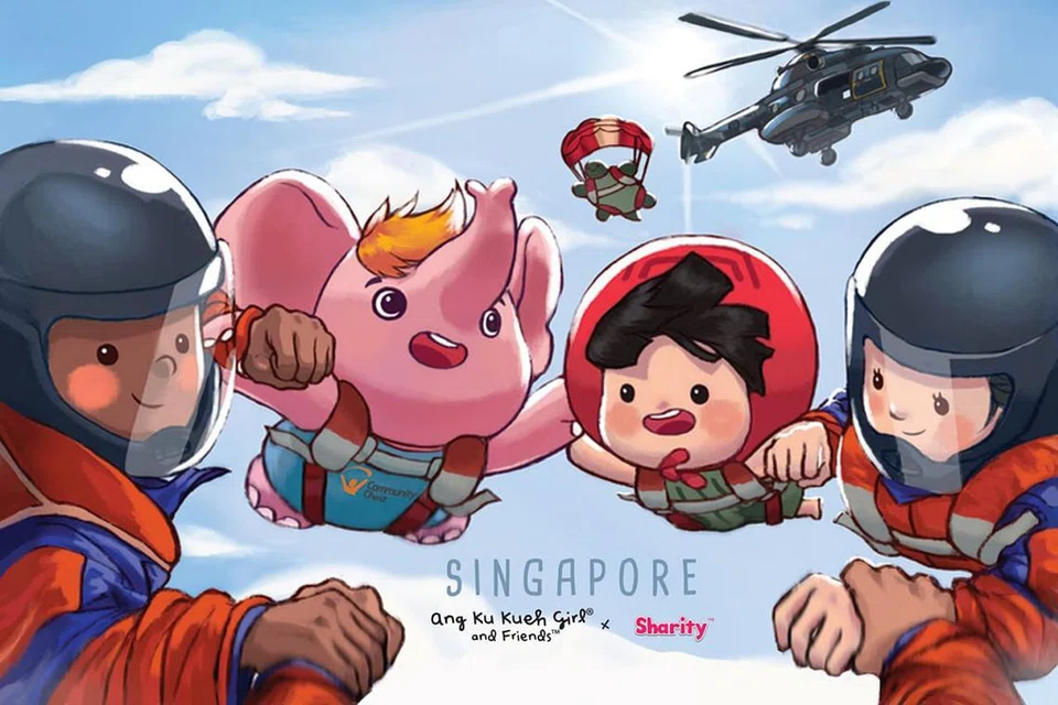 REKAAN COMEL: Inilah antara rekaan kad EZ-Link sempena Hari Kebangsaan tahun ini. Rekaan memaparkan Sharity Elephant dan Ang Ku Kueh Girl melakukan aksi terjun bebas bersama The Red Lions. - Foto EZ-LINK