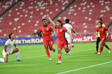 Pemain Singapura Farhan Zulkifli meraikan gol pembukaannya dalam kemenangan 3-2 Lions ke atas Myanmar. 