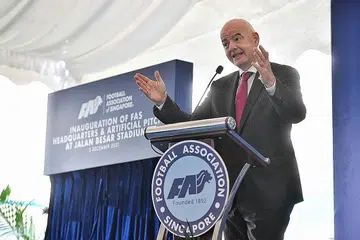 KATA-KATA DORONGAN: Infantino ketika berucap di perasmian ibu pejabat Persatuan Bola Sepak Singapura (FAS) yang telah diubah suai dan padang baru yang dipasang di Stadium Jalan Besar kelmarin. - Foto BH oleh CHONG JUN LIANG