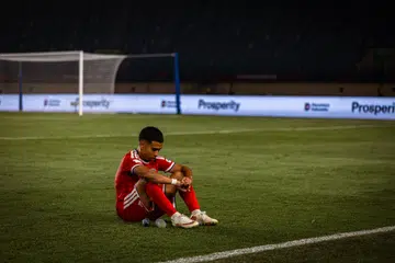 Pemain sayap Singa, Farhan Zulkifli, terduduk kecewa selepas skuad kebangsaan tewas 0-6 kepada Malaysia sekali gus tersingkir daripada kejohanan. Ketumpulan jentera serangan menjadi cabaran utama skuad Singa menjelang Piala Asia, kurang empat bulan pada Januari 2027.