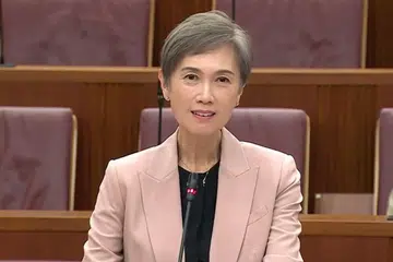 Program Impak AI Kebangsaan, NAIIP, Dwibahasa AI, Josephine Teo, MDDI, literasi AI Singapura, integrasi AI perniagaan