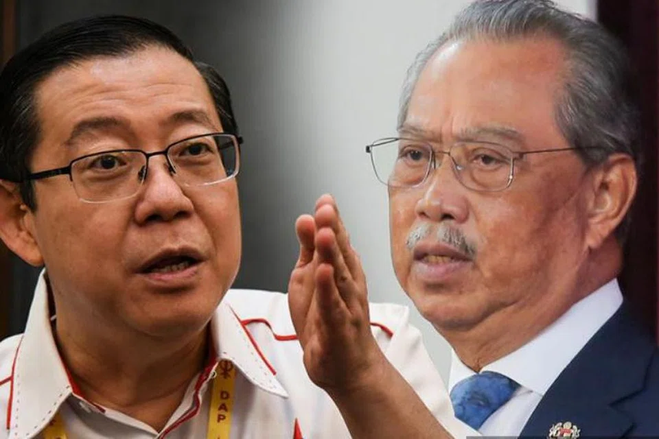 Bekas perdana menteri Malaysia, Tan Sri Muhyiddin Yassin (kanan), bayar saman fitnah RM1.35 juta kepada Pengerusi Parti Tindakan Demokratik (DAP), Encik Lim Guan Eng.