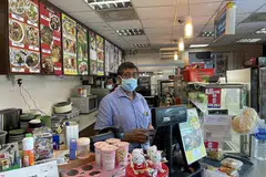 HARAP PELANCONG KEMBALI: Encik Abdul Malik berkata kedainya, Coffee and Snacks Temptation di Terminal Feri Tanah Merah terjejas teruk tanpa pelancong. Beliau memutuskan untuk membuka satu lagi kedai serupa di Shenton Way untuk membantu perniagannya. - Foto BH oleh SITI AISYAH NORDIN 