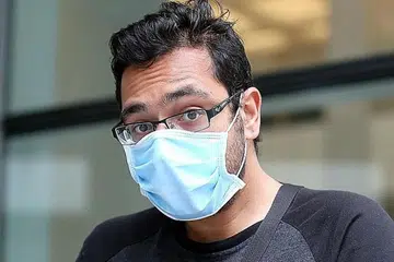 HADAPI TUDUHAN: Salah seorang dari tiga warga setempat, Quresh Singh Sandhu, didakwa di mahkamah semalam kerana pergi bekerja di Marina Bay Sands sekembalinya dari Batam, walaupun diberi SNH.