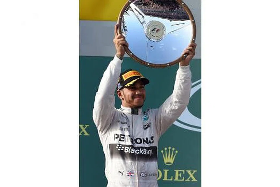 JUARA GP AUSTRALIA LEWIS HAMILTON. - Foto AFP