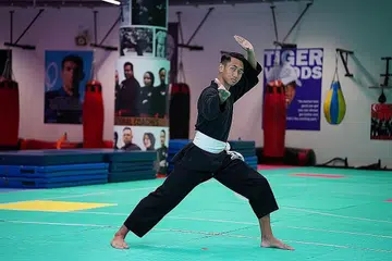 JAGUH DUNIA: Penglibatan Encik Aniq Asri Mohammad Yazid dalam dunia persilatan mengajarnya erti rendah hati..
