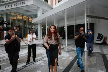 Cik Raeesah Khan meninggalkan Mahkamah Negara pada 14 Oktober 2024.