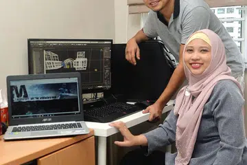 MELEBARKAN SAYAP: Encik Zubri dan isteri, Sharifah Nor Baizura, membentuk cabang perniagaan bidang animasi diberi nama VA Studios di sini selepas menstabilkan perniagaan di Malaysia. - Foto KHALID BABA