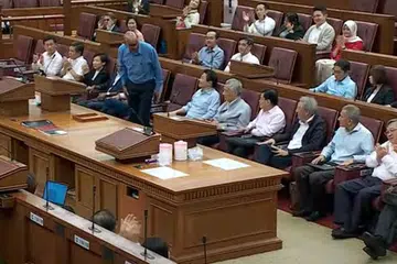 RAKAM PENGHARGAAN: Sidang Parlimen pada Khamis adalah yang terakhir bagi Menteri Kanan merangkap Menteri Penyelaras bagi Dasar Sosial, Encik Tharman Shanmugaratnam (berdiri), dan sembilan Anggota Parlimen Dilantik (NMP).