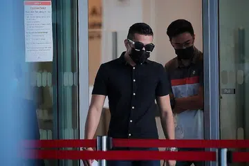 BERSALAH: Amirul Asyraff Muhammad Junus mengaku bersalah semalam atas satu tuduhan bersubahat dengan anggota geng untuk menyeludup pistol dari Malaysia ke Singapura. - Foto BH oleh JASON QUAH
