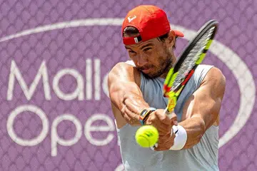 TERUS BERMAIN: Rafael Nadal tidak berasa dirinya 'tua' walau baru sahaja menyambut ulang tahunnya yang ke-32, dan masih terus menikmati bermain tenis di peringkat antarabangsa. - Foto EPA-EFE