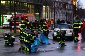 Polis dan anggota bomba mengumpulkan bahan bukti selepas kereta yang dipandu pencari suaka asal Afghanistan merempuh perhimpunan kesatuan sekerja di Munich pada 13 Februari.