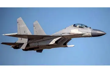 TUNJUK KUASA: (Gambar atas) Kementerian Pertahanan Nasional Taiwan mengongsi gambar menunjukkan pesawat pejuang China, PLA Shenyang J-16, melintasi zon pertahanan udara Taiwan pada 2 Oktober lalu. - Foto EPA-EFE 