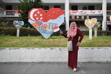 ANAK MERDEKA: Cik Norrita Mohd Amin berharap sedang penduduk di negara ini semakin menua, semoga warga Singapura akan terus menghargai hubungan kekeluargaan dan masyarakat serta terus menyokong satu sama lain. - Foto BM oleh SHINTARO TAY