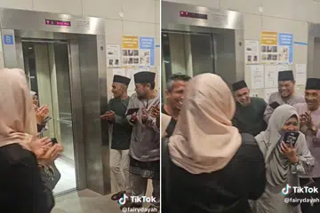 Ahli keluarga memberi tepukan apabila salah seorang saudara yang tertinggal di tingkat atas terpaksa turun lif seorang diri untuk tiba di tingkat satu.