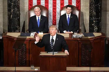 LAKAR ARAH TUJU: Encik Donald Trump (depan) berucap di Dewan Kongres bagi membentangkan apa isu yang ingin ditanganinya pada tahun pertama di Rumah Putih. Di belakangnya iala Naib Presiden Mike Pence (kiri) dan Speaker Dewan, Encik Paul Ryan. - Foto AFP