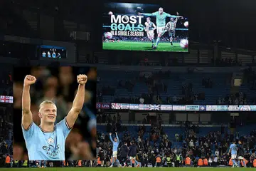 REKOD BARU: Skrin gergasi mengiktiraf penyerang Manchester City dari Norway, Erling Haaland, menjaringkan 'gol terbanyak dalam satu musim' selepas City menewaskan West Ham 3-0 di Stadium Etihad pada Rabu. - Foto-foto AFP, EPA-EFE