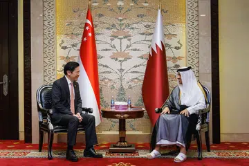 Perdana Menteri, Encik Lawrence Wong (tiga dari kiri), bertemu Perdana Menteri merangkap Menteri Luar Qatar, Sheikh Mohammed Bin Abdulrahman Al Thani, di Doha, Qatar, pada 18 Oktober.