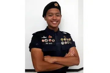 TETAPKAN HALUAN KONTINJEN: Muhammad Akid Hilman Azhar akan berbaris dalam kontinjen Pasukan Kadet Pertahanan Awam Kebangsaan (NCDCC) dalam Perbarisan Hari Kebangsaan (NDP) tahun ini. - Foto NUR DHUHA ESOOF