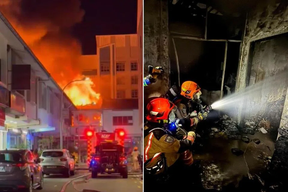 Anggota bomba terpaksa memecah masuk ke dalam rumah kedai yang terbakar dan menggunakan dua jet air untuk memadamkan api.