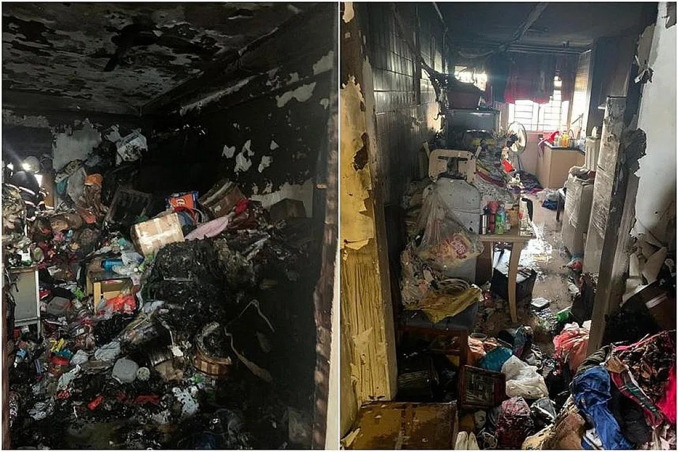 BOMBA DIHAMBAT TIMBUNAN BARANG: Pergerakan anggota bomba memadam api dalam flat yang terbakar terhambat kerana mereka harus berhati-hati bergerak di tengah-tengah timbunan barang. - Foto SCDF