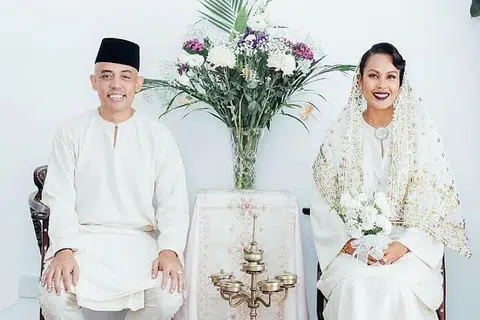 AKHIRNYA MAHLIGAI DIBINA: Persahabatan 15 tahun bagi Joe Flizzow (kiri) dan Marini Ramlan berakhir di jenjang pelamin selepas majlis pernikahan awal yang dijadualkan pada 4 April lalu terpaksa ditunda kepada 26 Jun lalu kerana Perintah Kawalan Pergerakan ekoran wabak Covid-19. - Foto INSTAGRAM MARINI RAMLAN