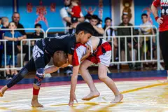 WARGA PERTAMA: Pada usia sembilan tahun, Rumi Rangkayo Noorman (kiri) dipercayai merupakan warga Singapura pertama yang menyertai kejohanan sukan gusti, atau ‘grappling’ di Dagestan, Russia.