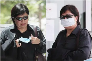 HANYA PAKAI PELITUP DI PINTU MASUK: Phoon Chiu Yoke tidak menggunakan pelitup dan hanya memakai kaca mata hitam ketika menghampii bangunan Mahkamah Negara. Namun, di muka pintu bangunan itu, barulah dia menggunakan pelitup. - Foto oleh KELVIN CHNG 