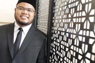 Ustaz Khairul Anwar Mohamed Aznan (gambar atas)