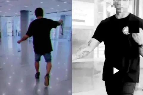RAKAMAN TERLARANG: Video menunjukkan Mohd Heirizal Kamarzaman berjalan dengan gaya samseng dan membuat tanda lucah dengan tangannya.