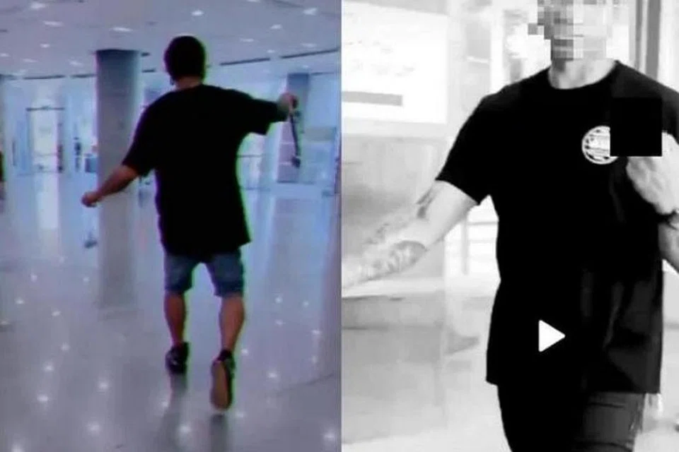 RAKAMAN TERLARANG: Video menunjukkan Mohd Heirizal Kamarzaman berjalan dengan gaya samseng dan membuat tanda lucah dengan tangannya.