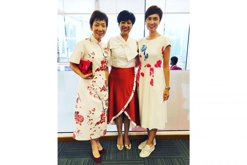 GAYA TERSENDIRI: (Dari kiri) Cik Grace Fu, Cik Indranee Rajah dan Cik Josephine Teo tampil dengan gaya tersendiri semasa ke NDP kelmarin.
