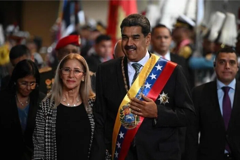 Presiden Venezuela, Nicolas Maduro, bersama isterinya, Cilia Flores, di Caracas. 