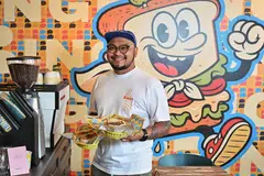 KAFE BERKONSEP CERIA: Pemilik Binge, Encik Arfian Ishak, membuka kafe dengan konsep sandwic dan burger, di 61 Seng Poh Lane di daerah Tiong Bahru. 