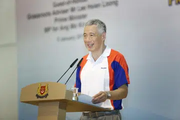 PENTING UNTUK BERJAYA: Encik Lee berkata warga Singapura juga perlu mempunyai nilai yang tidak ketara tetapi penting.