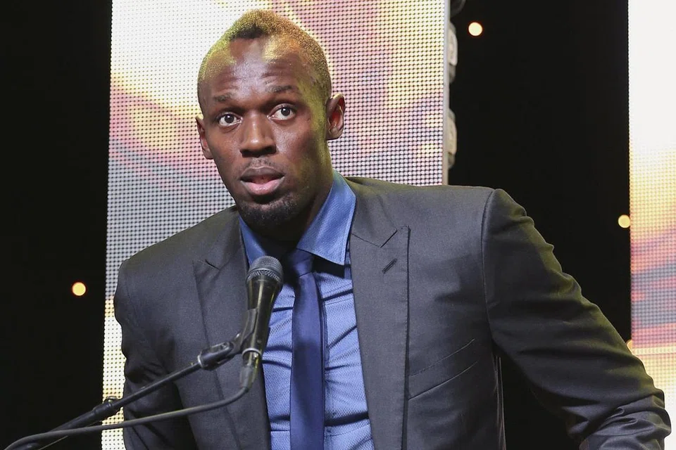 MELABUHKAN TIRAI OLIMPIK: Raja pecut Jamaica, Usain Bolt, semasa berucap selepas menerima anugerah Olahragawan Nasional Jamaica di Kingston pada Januari lalu. - Foto REUTERS