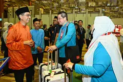 Faishal, jemaah haji, Lapangan Terbang Changi, kumpulan pertama