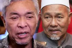 Timbalan Perdana Menteri Malaysia yang juga Presiden Umno, Datuk Seri Dr Ahmad Zahid Hamidi (kiri), dan Timbalan Presiden Parti Islam SeMalaysia (PAS), Datuk Seri Tuan Ibrahim Tuan Man (kanan).